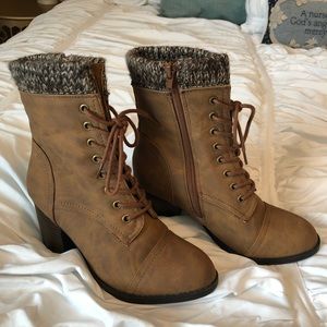Tan sweater top lace up boots.